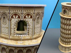 Miniature Leaning Tower of Pisa model shown from two angles on a blue background.