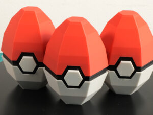 Pokéball egg set with red-and-white shell halves and black center button details